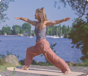 Carly Snedeker making Yoga asana near lake in Zurich on mat